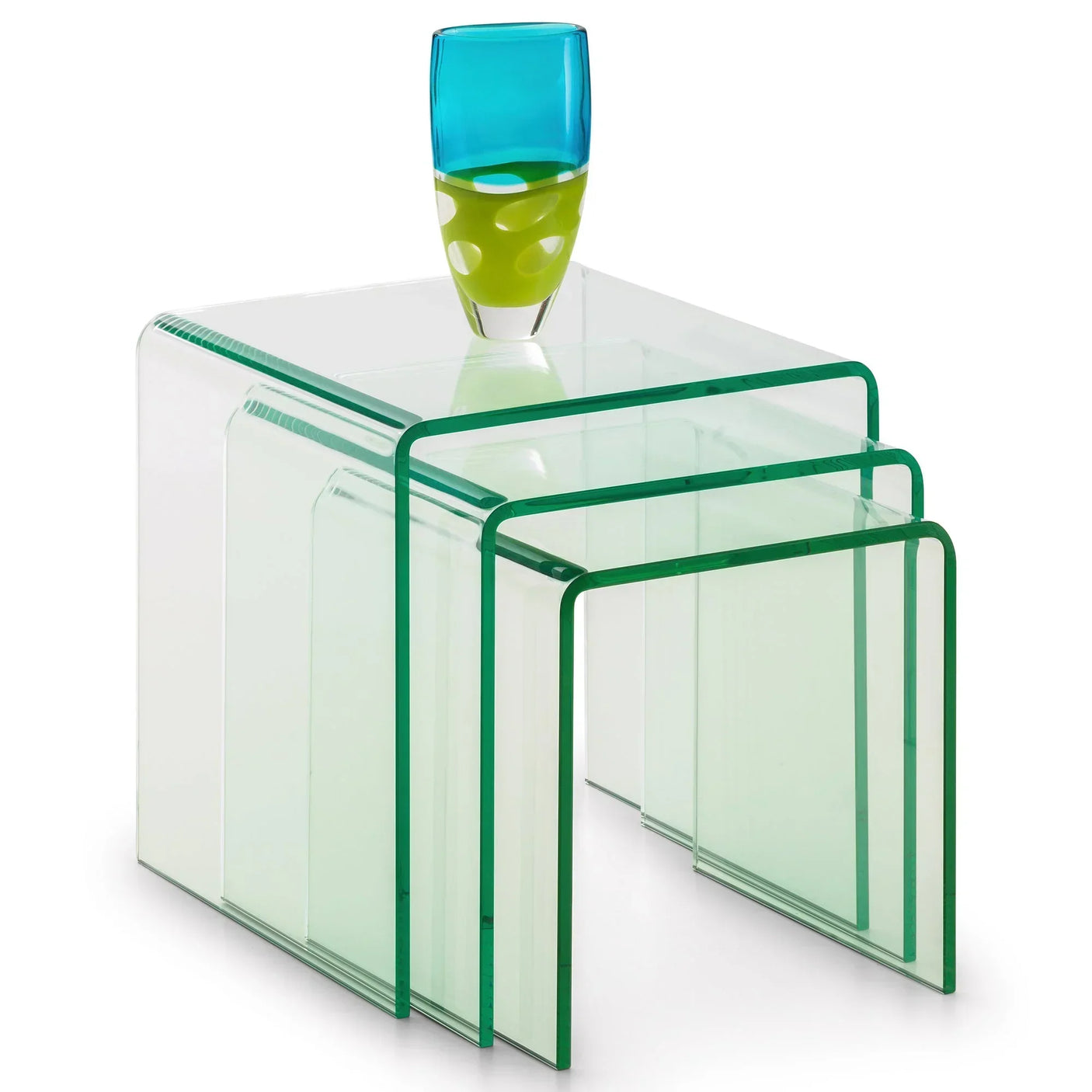 Glass nest of tables with green edges and blue green vase on top, modern living room