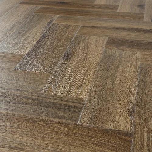 Antique walnut herringbone flooring with natural wood grain texture and brown color variation