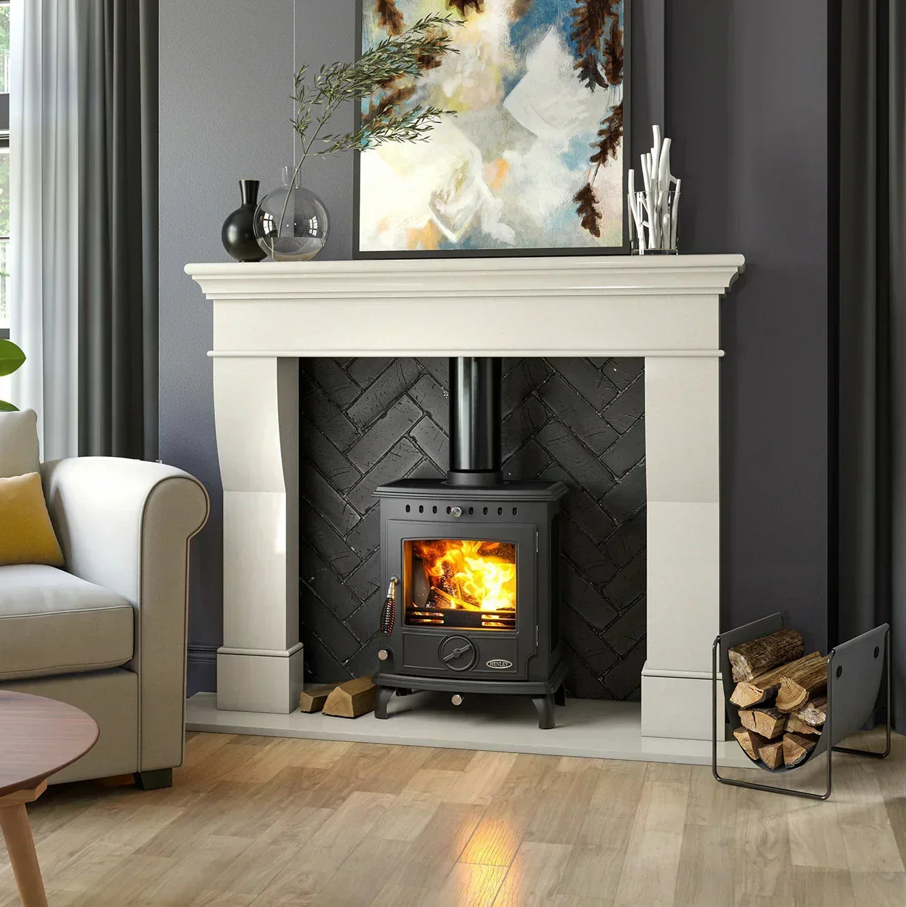 Black freestanding wood burner stove with fire, stone fireplace, and stacked firewood holder