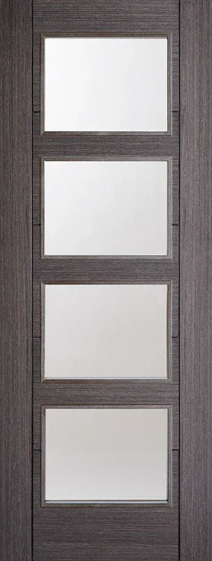 Ash grey interior door with four glazed panels and wood grain finish, full front view