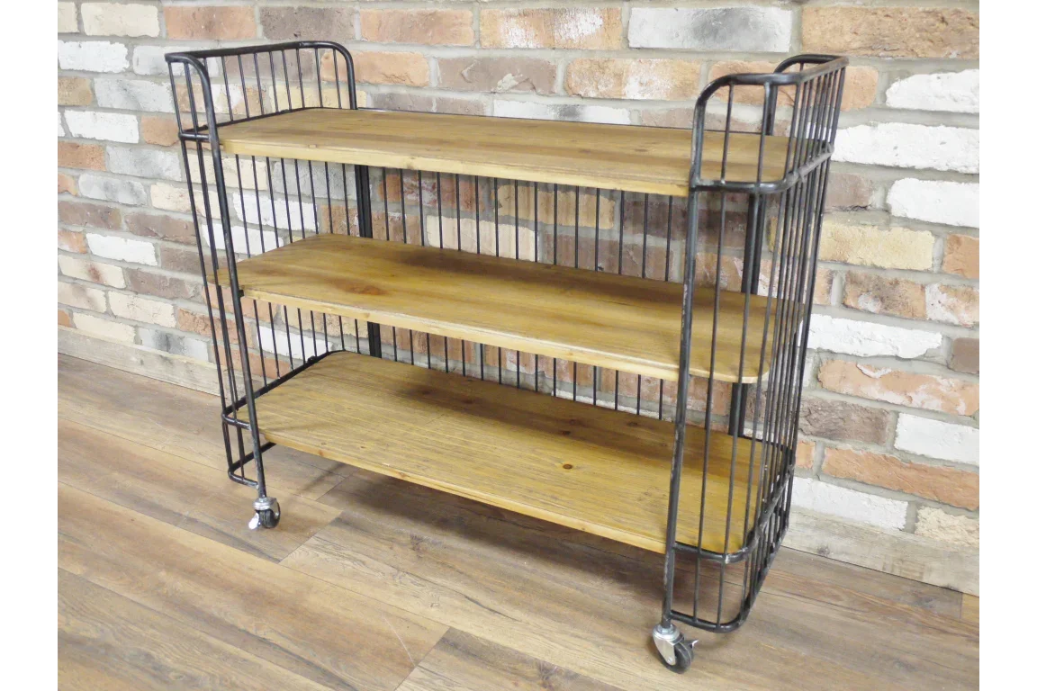 Industrial shelving unit with three wooden shelves and black metal frame on wheels