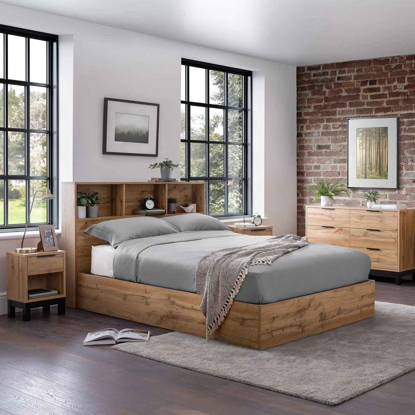 Natural oak ottoman storage bed with shelves in modern bedroom, grey bedding, wood furniture