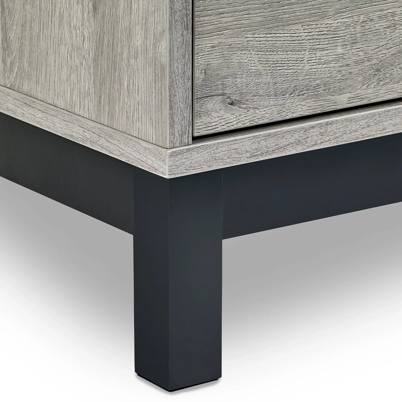 Close-up of Bali 6 drawer wide chest corner with light wood finish and black metal leg