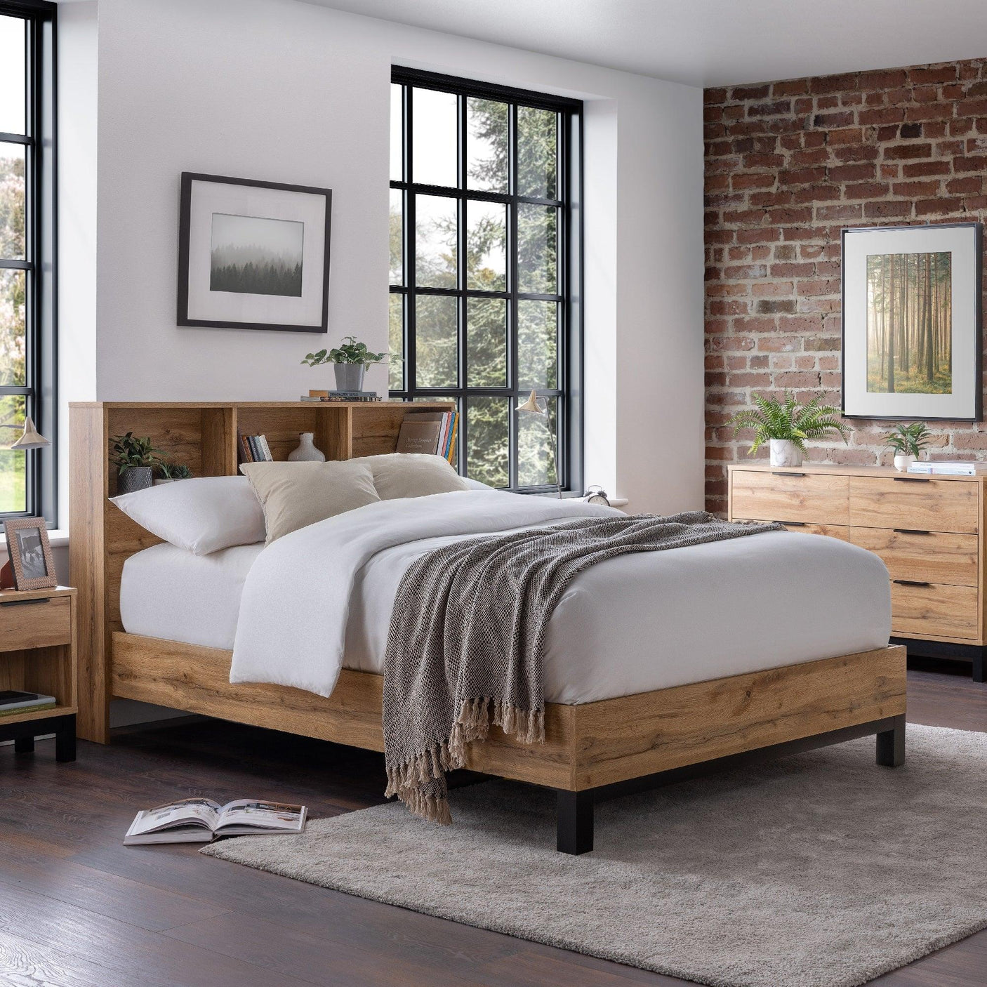 Oak double bed with bookshelf headboard, white bedding, in modern bedroom setting