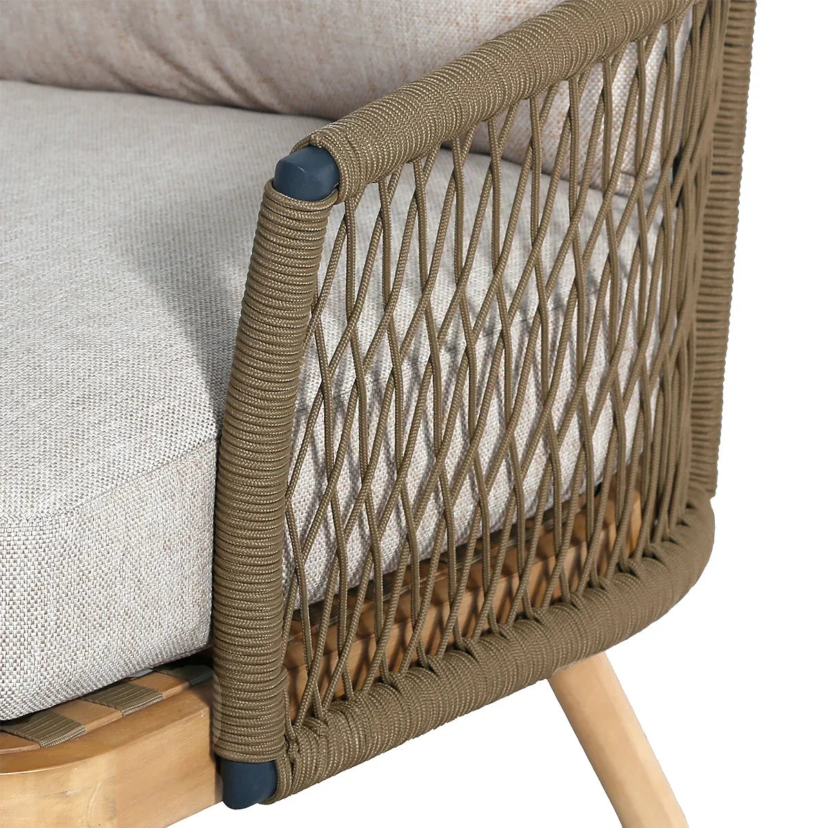Rope detail on outdoor sofa armrest with beige cushion and wooden leg