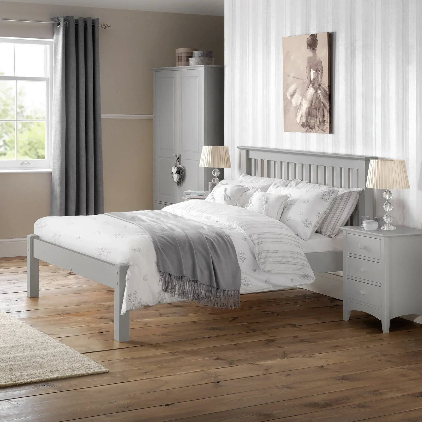 Dove grey double bed with slatted headboard in bright bedroom with matching bedside tables