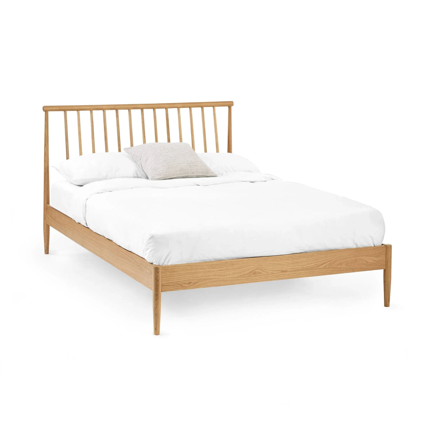Oak wooden bed frame with slatted headboard and white bedding