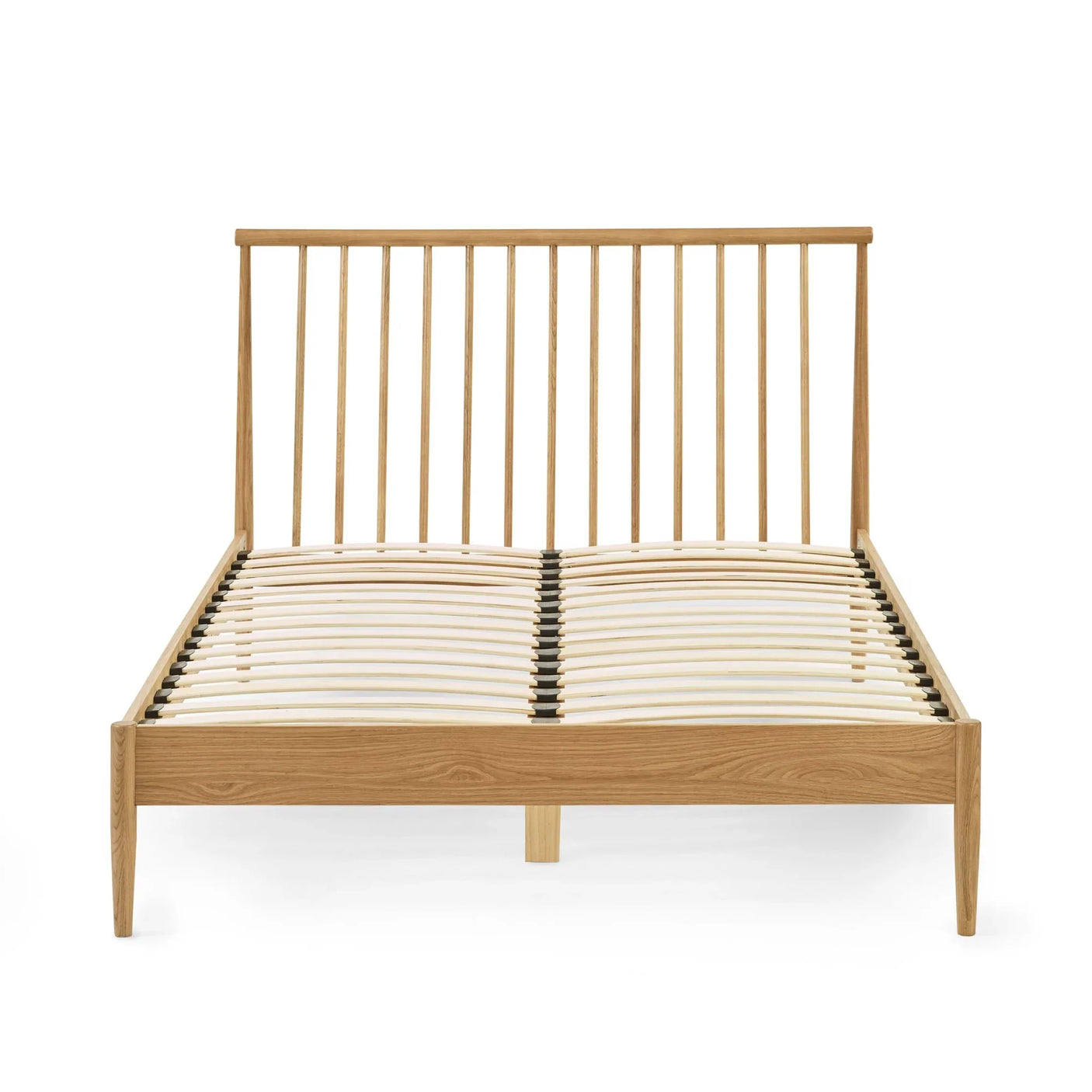 Wooden bed frame with slatted base and spindle headboard in natural oak finish, front view