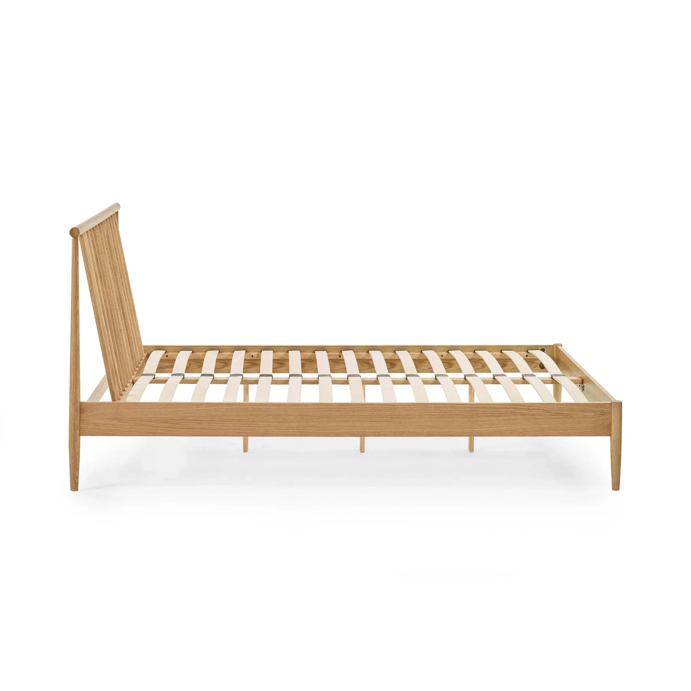 Side profile of wooden bed frame with slatted base and angled headboard