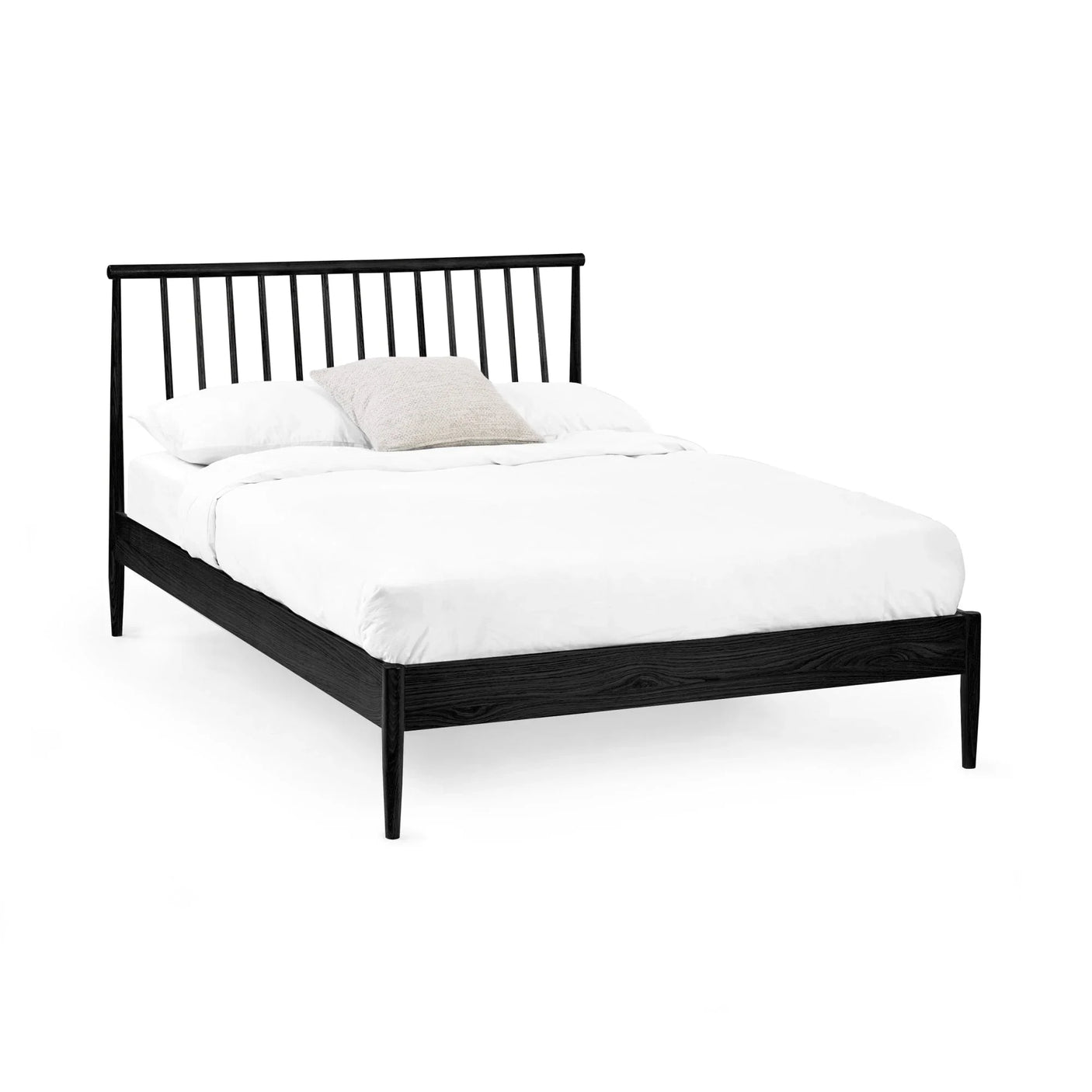 Black wooden bed frame with spindle headboard and white bedding