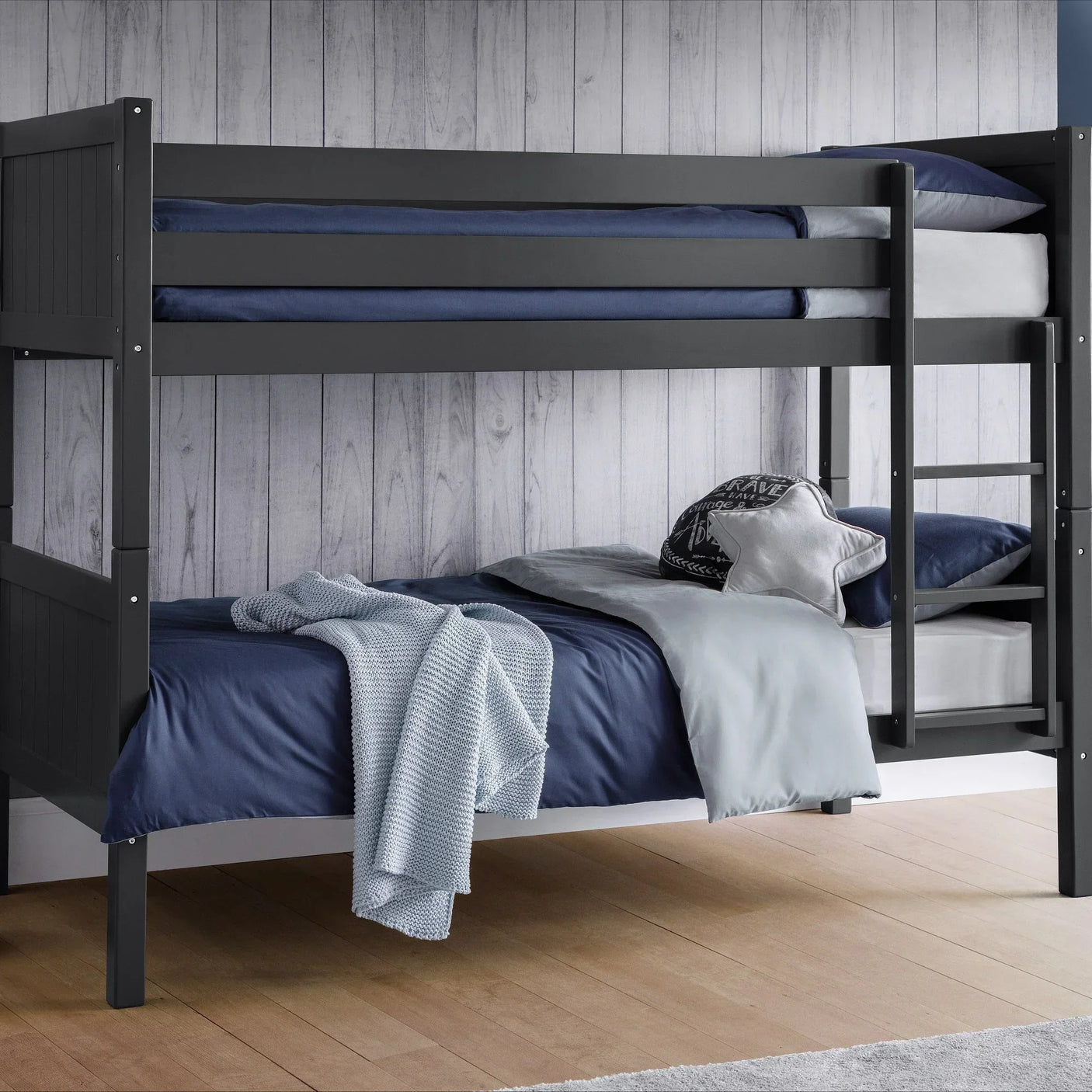 Anthracite bunk bed with navy bedding and ladder in a wood-panelled bedroom