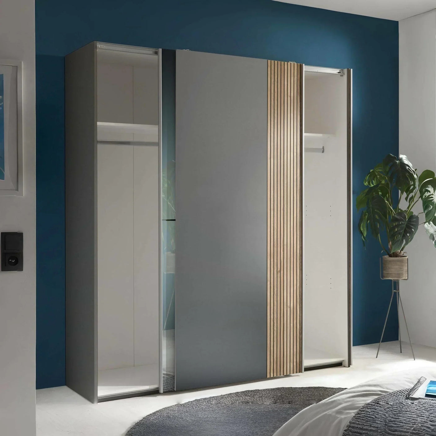 Grey sliding wardrobe with wood panels and mirror doors in modern bedroom