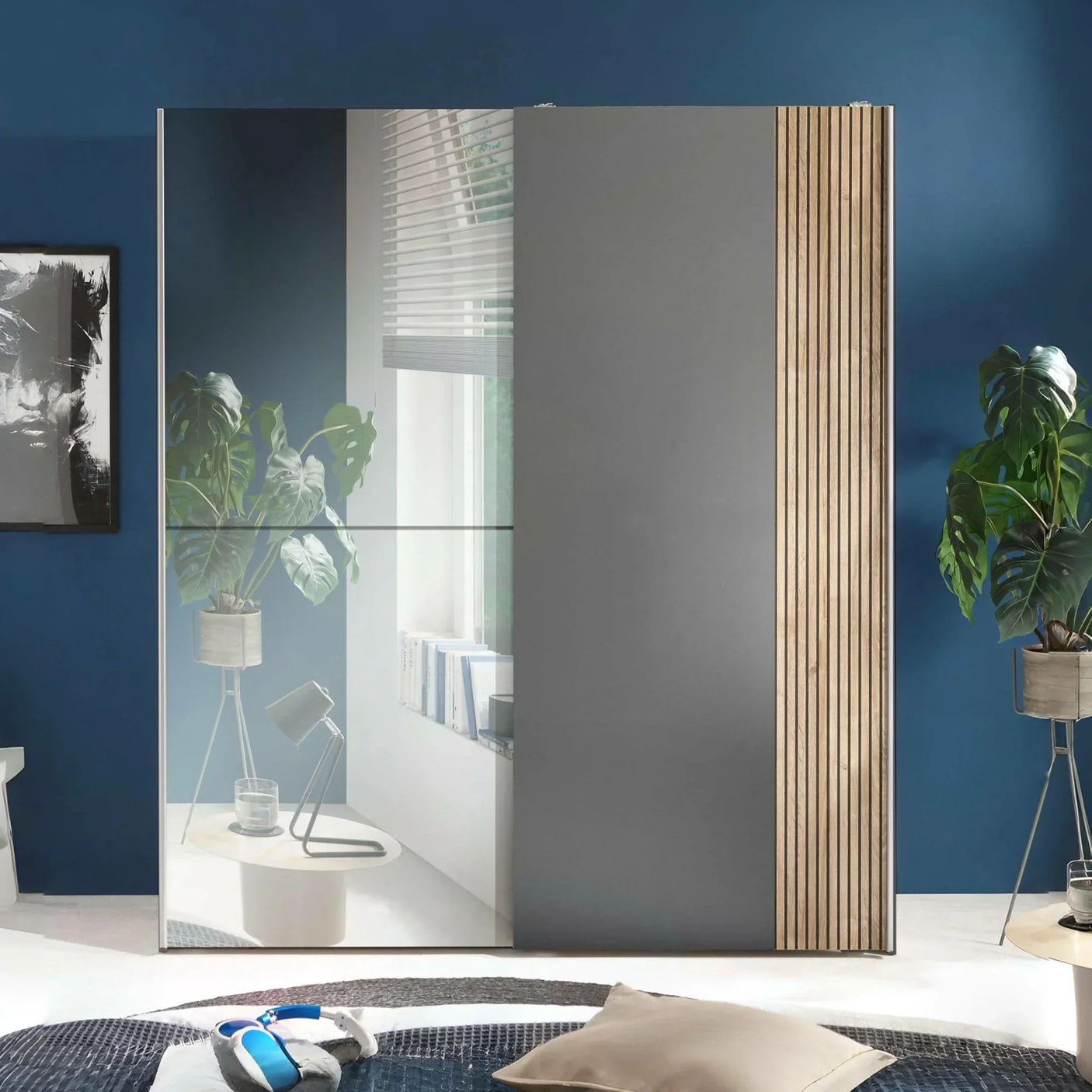Grey sliding wardrobe with mirrored door and wood panel detail in modern bedroom
