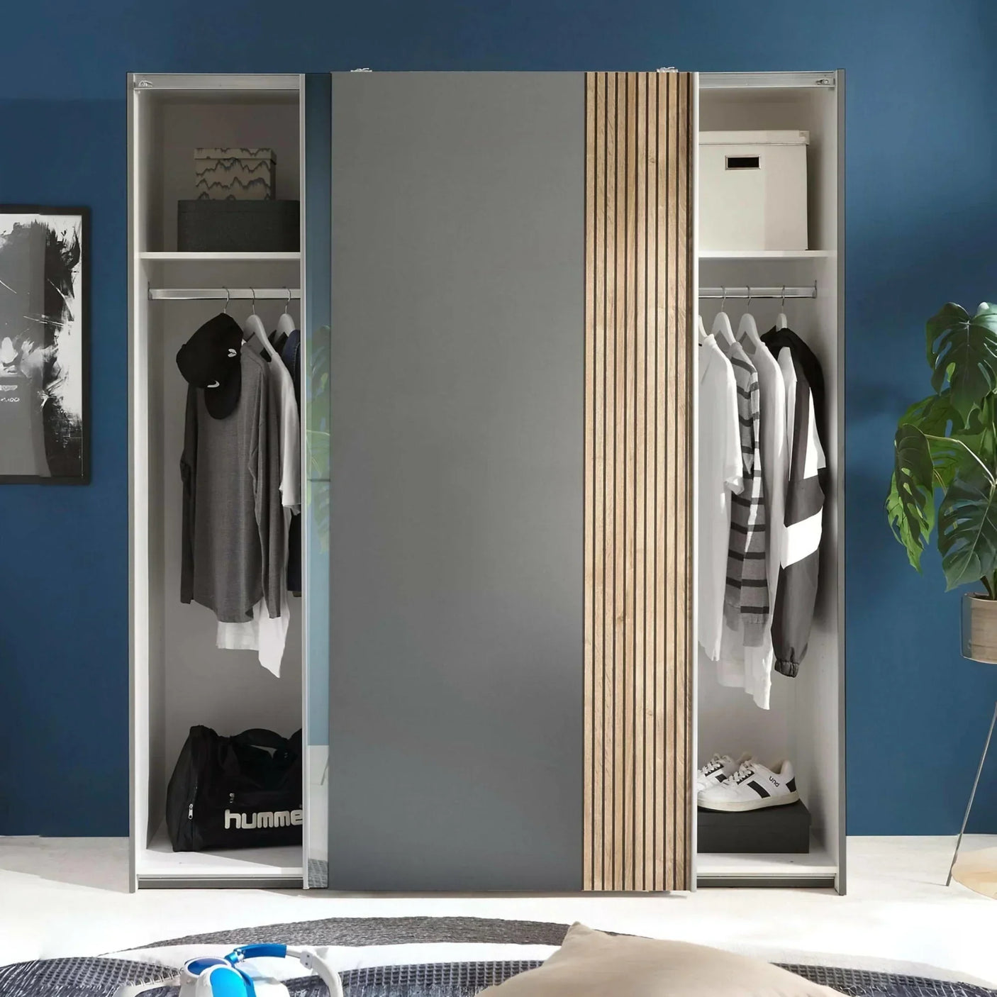 Grey sliding door wardrobe with hanging rail, storage shelves, and wood panel detail