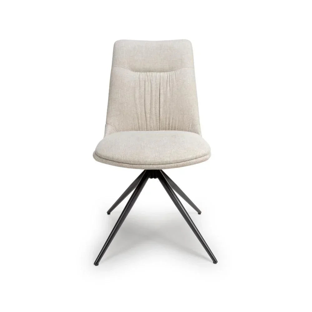 Beige fabric dining chair with cushioned seat and black metal legs, front view