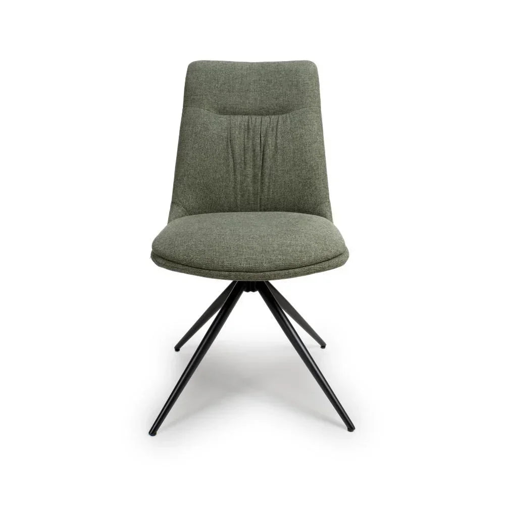 Green fabric dining chair with padded seat and black metal legs, front view