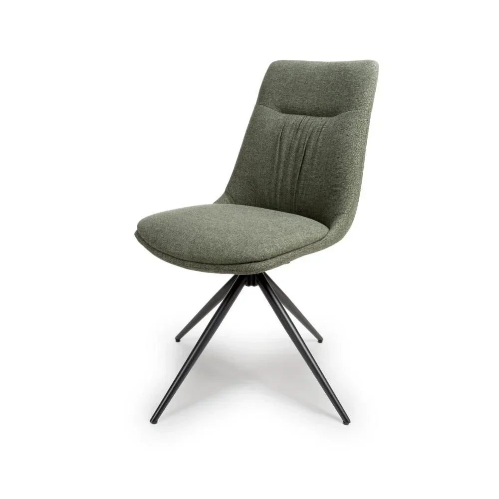 Green fabric dining chair with black metal legs, angled front view