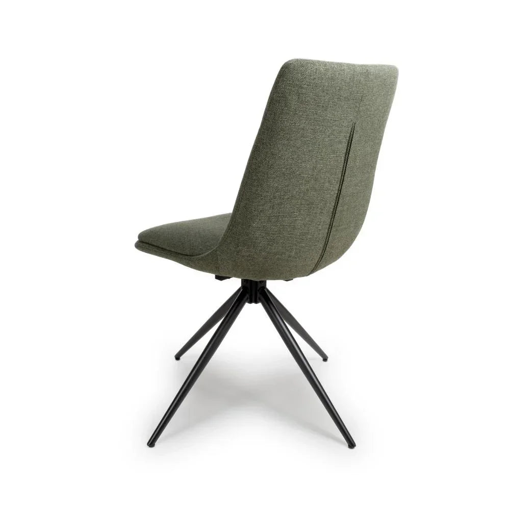 Sage green fabric dining chair with black metal legs, rear view