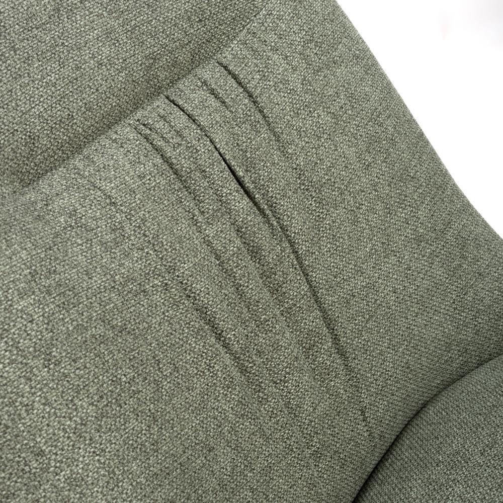 Closeup of textured green sofa fabric with stitched backrest details