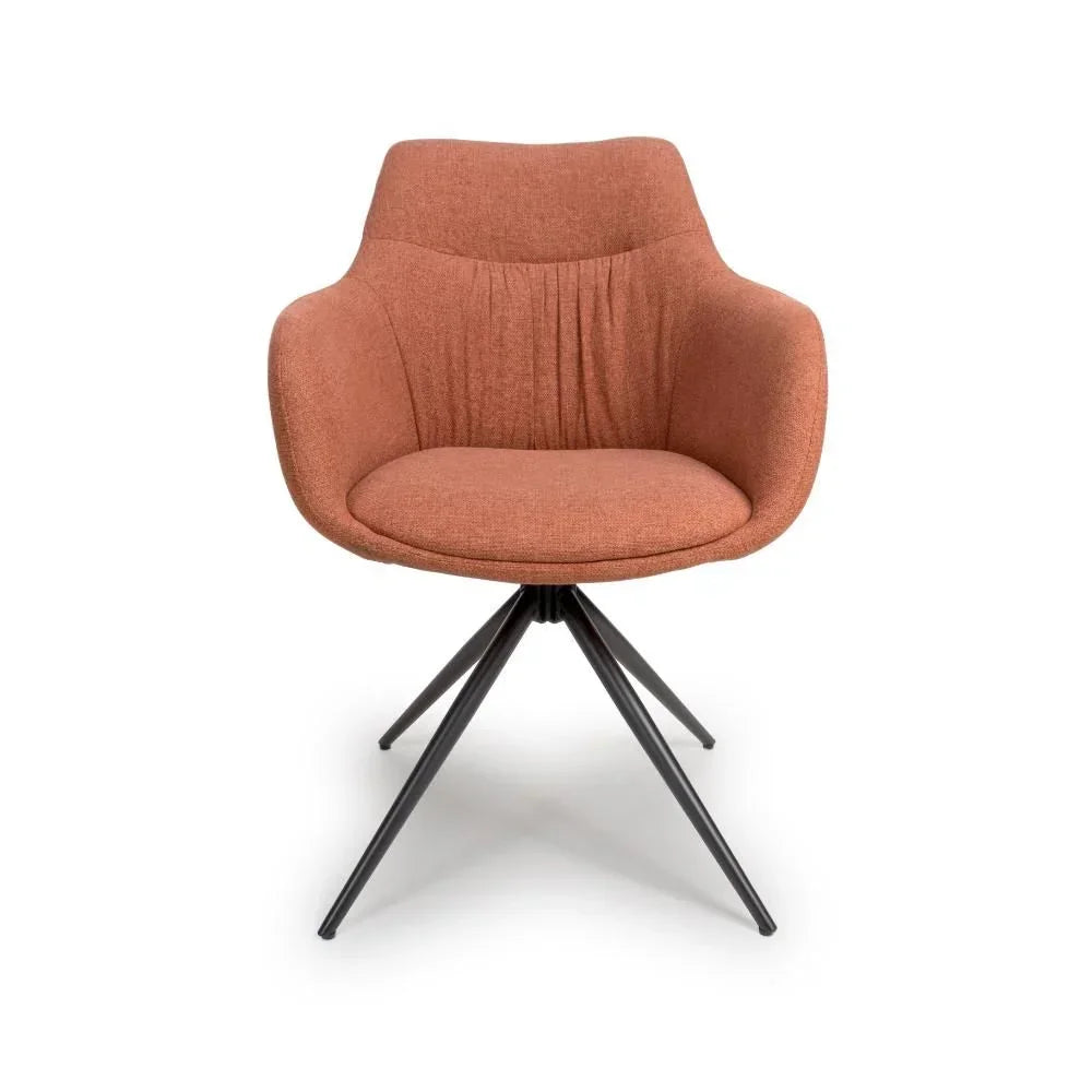 Rust fabric accent chair with metal legs, front view, curved armrests and stitched detail