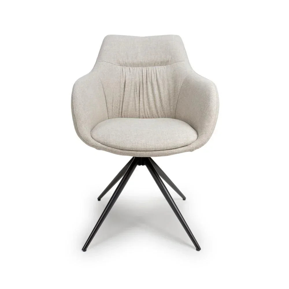 Beige fabric accent chair with curved backrest and black metal legs, front view