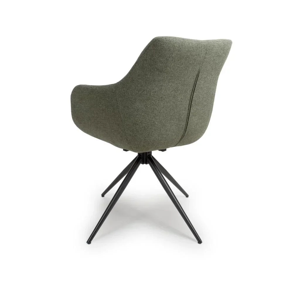 Green fabric dining chair with curved back and black metal legs, rear angle view