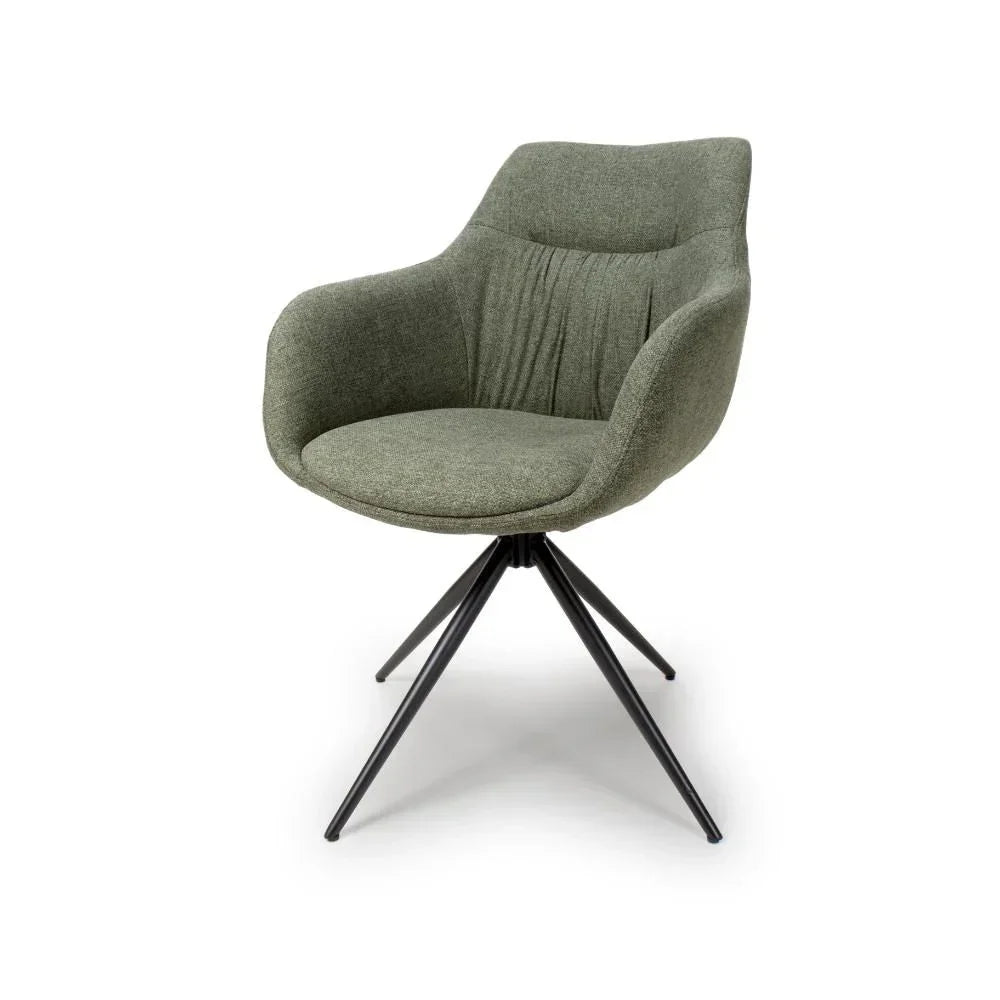 Green fabric accent chair with black metal legs and curved backrest