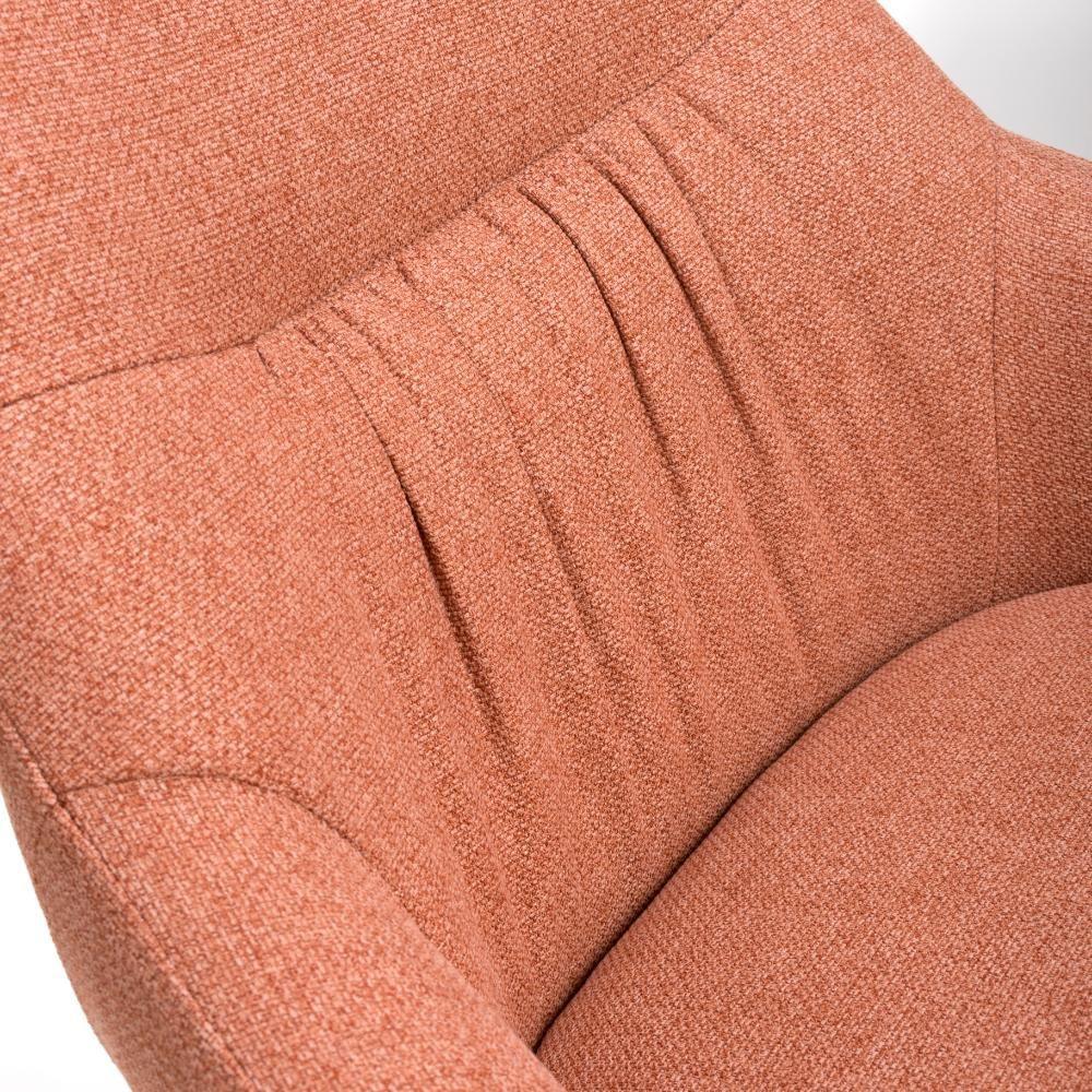 Close-up of textured orange fabric armchair with pleated backrest detail