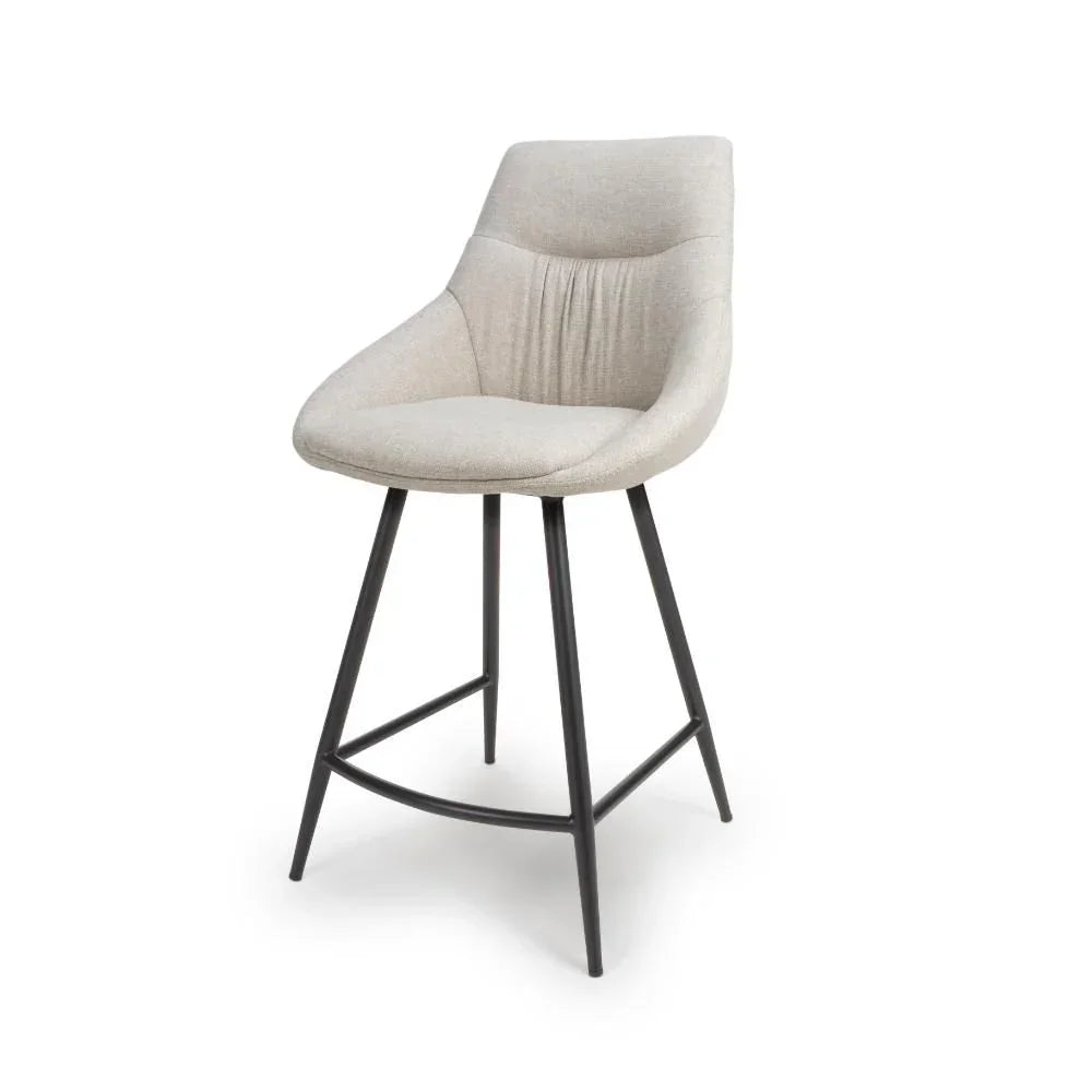 Beige fabric bar stool with curved backrest and black metal legs