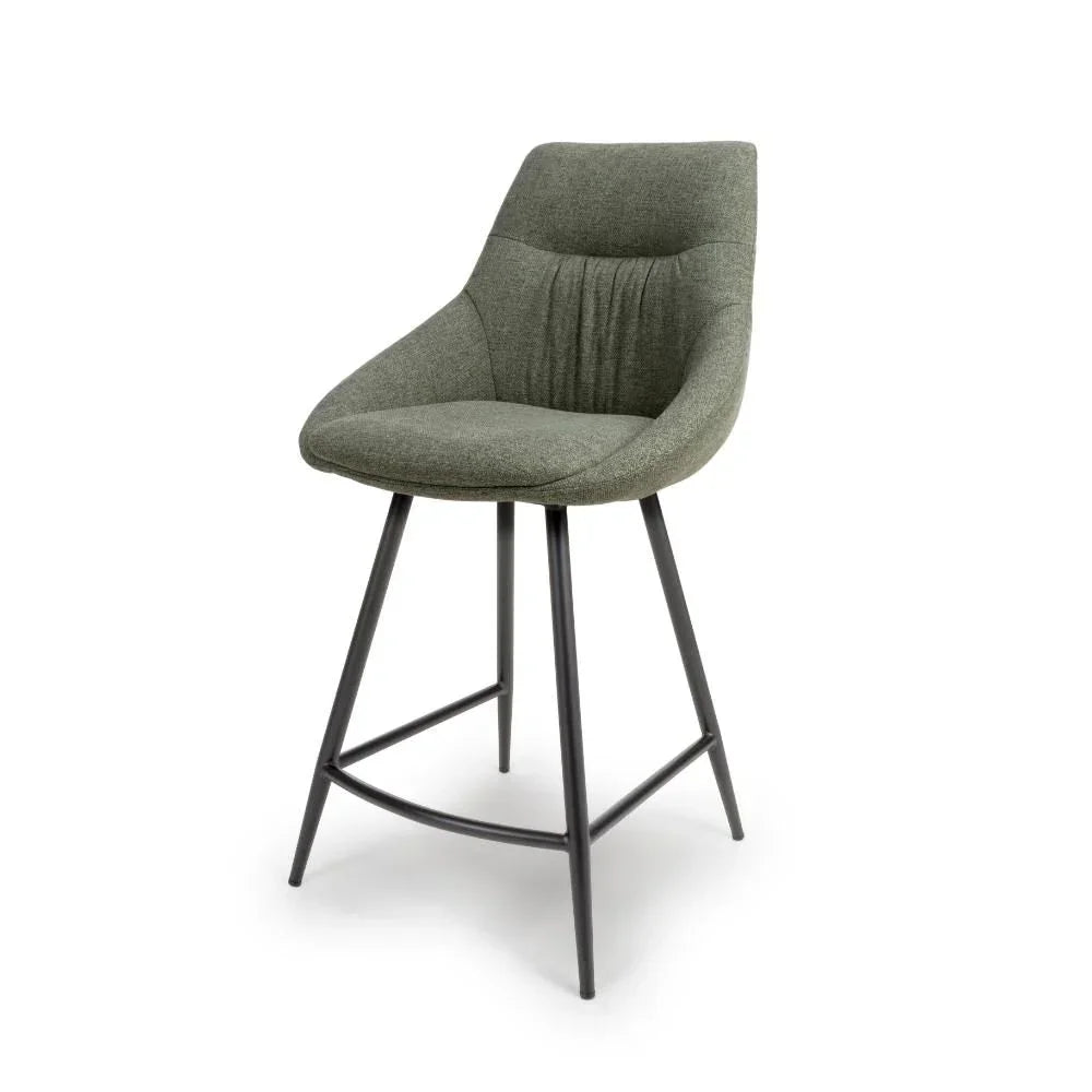 Green fabric bar stool with black metal legs and curved backrest