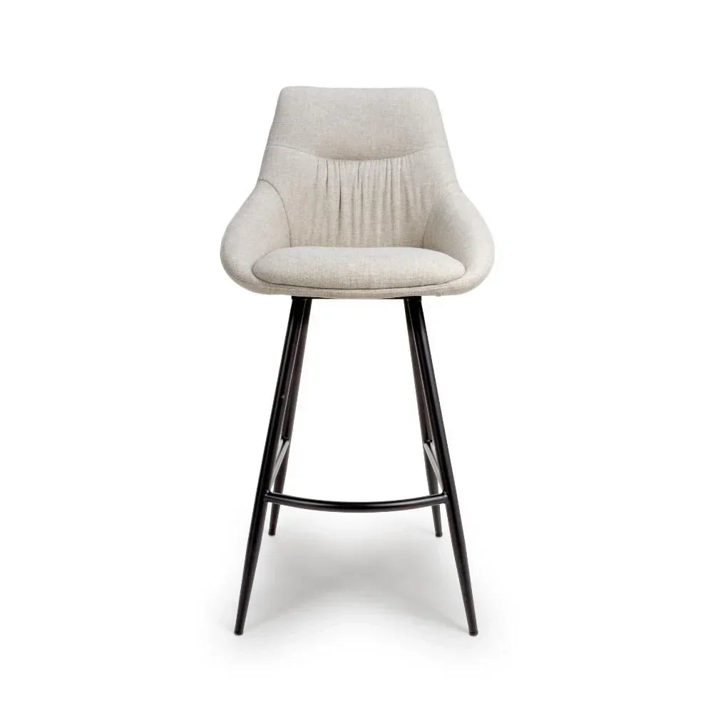 Beige fabric bar stool with curved backrest and black metal legs, front view