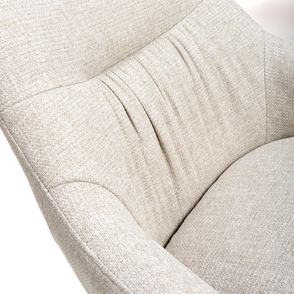 Close-up of beige fabric armchair with curved backrest and stitched seam detail