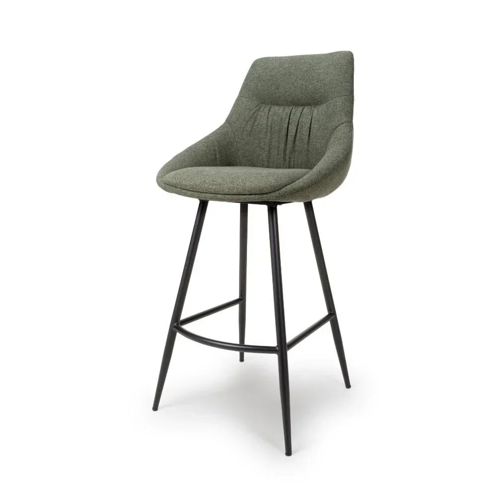 Grey fabric bar stool with curved backrest and black metal legs on white background