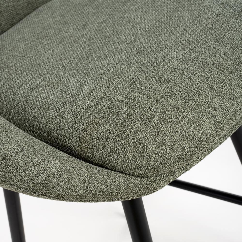 Close-up of grey fabric dining chair seat with black metal legs