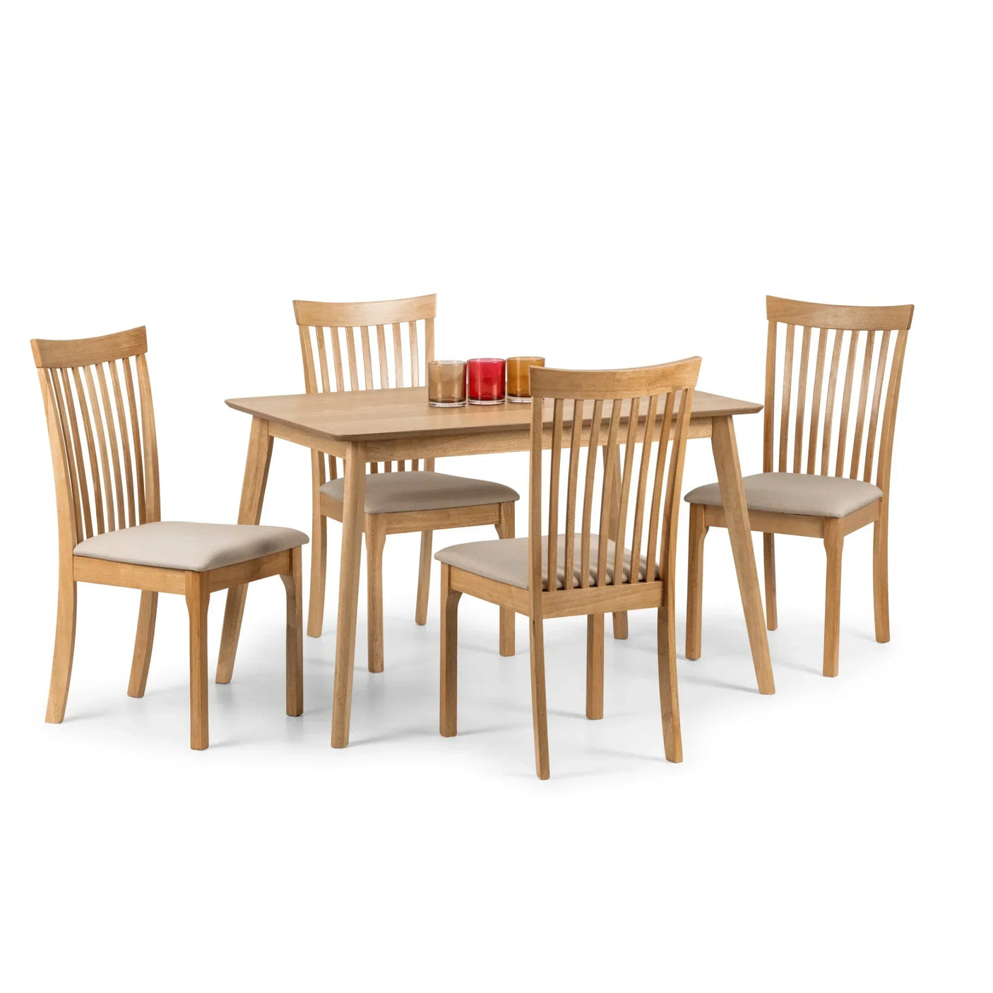 Oak rectangular dining table with four slatted chairs and candles on top