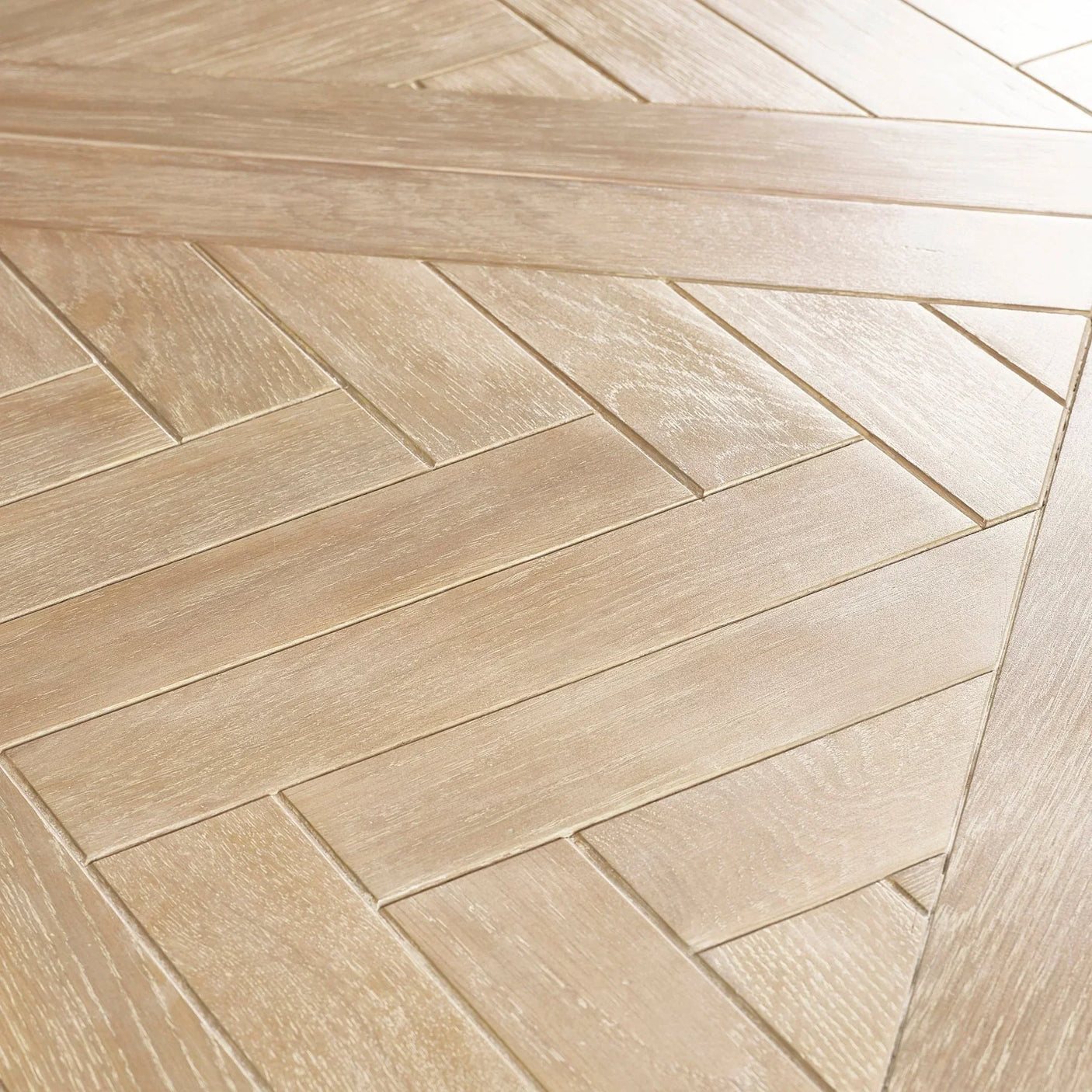 Close up of Bordeaux extending dining table with light wood herringbone patterned surface