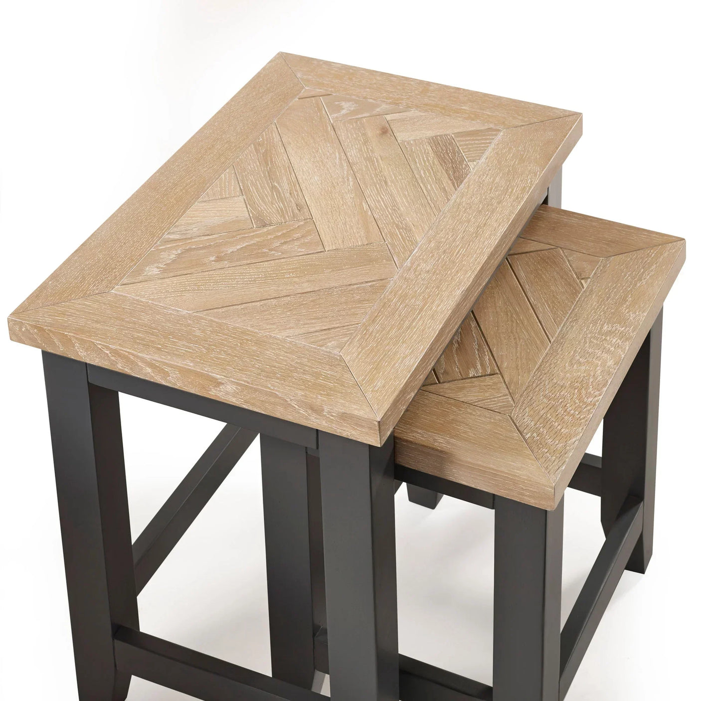 Wood nest of tables with chevron pattern tops and black legs, stacked together