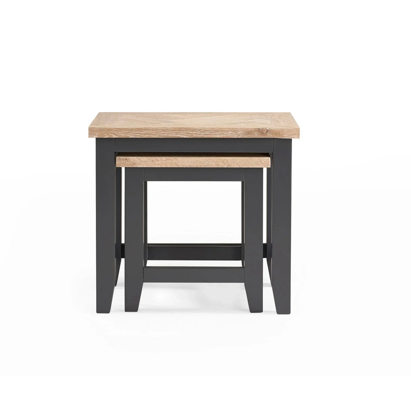 Two nesting tables with oak tops and dark painted wooden legs, front view