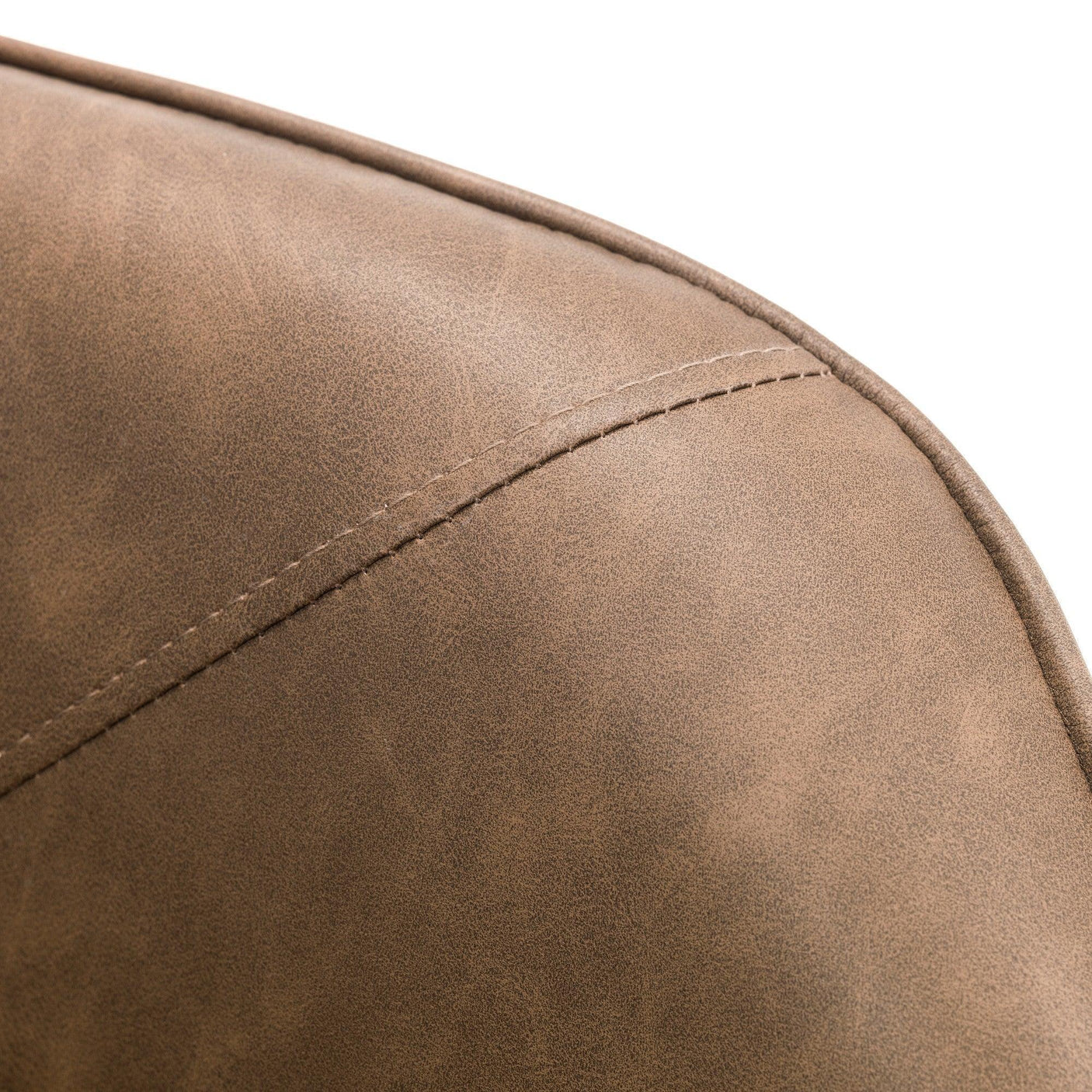 Closeup of brown faux leather chair upholstery with visible stitching detail