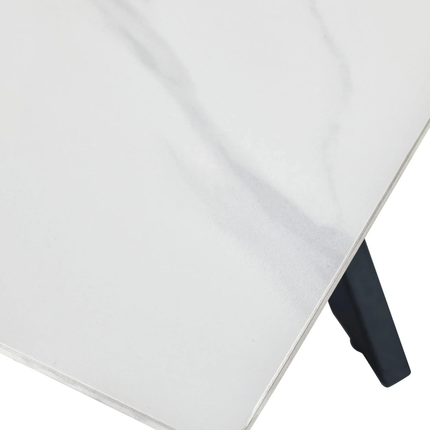 White marble dining table top with subtle grey veining and black metal leg detail