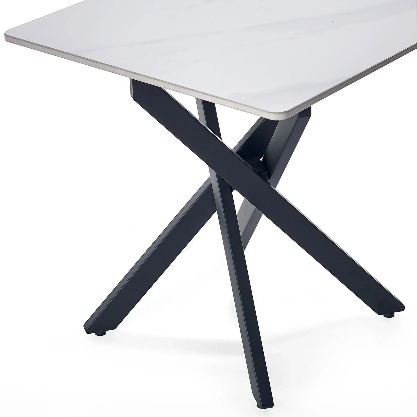 White marble lamp table corner with intersecting black metal legs and smooth top detail