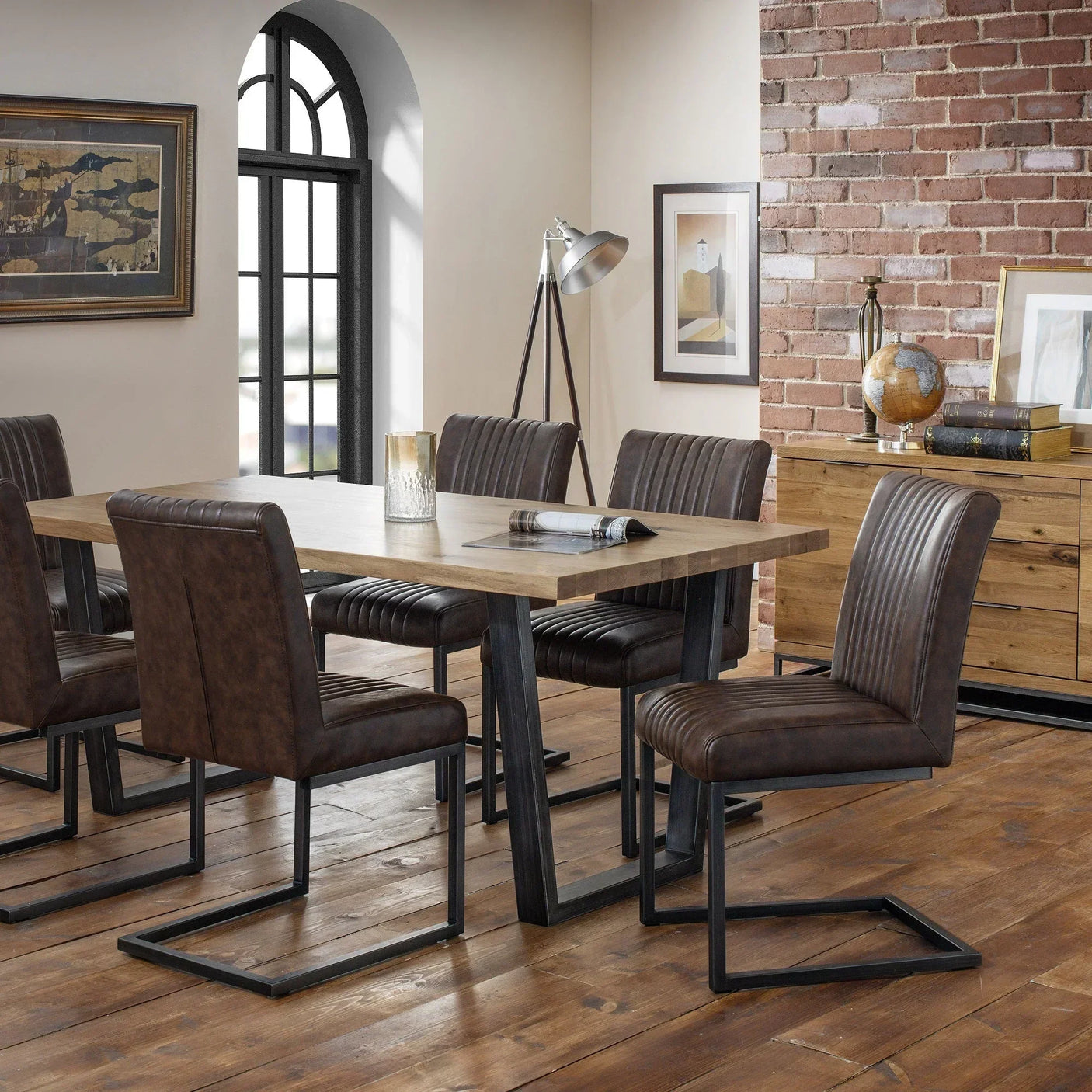 Brown dining chair with metal legs at wooden dining table in modern loft dining room
