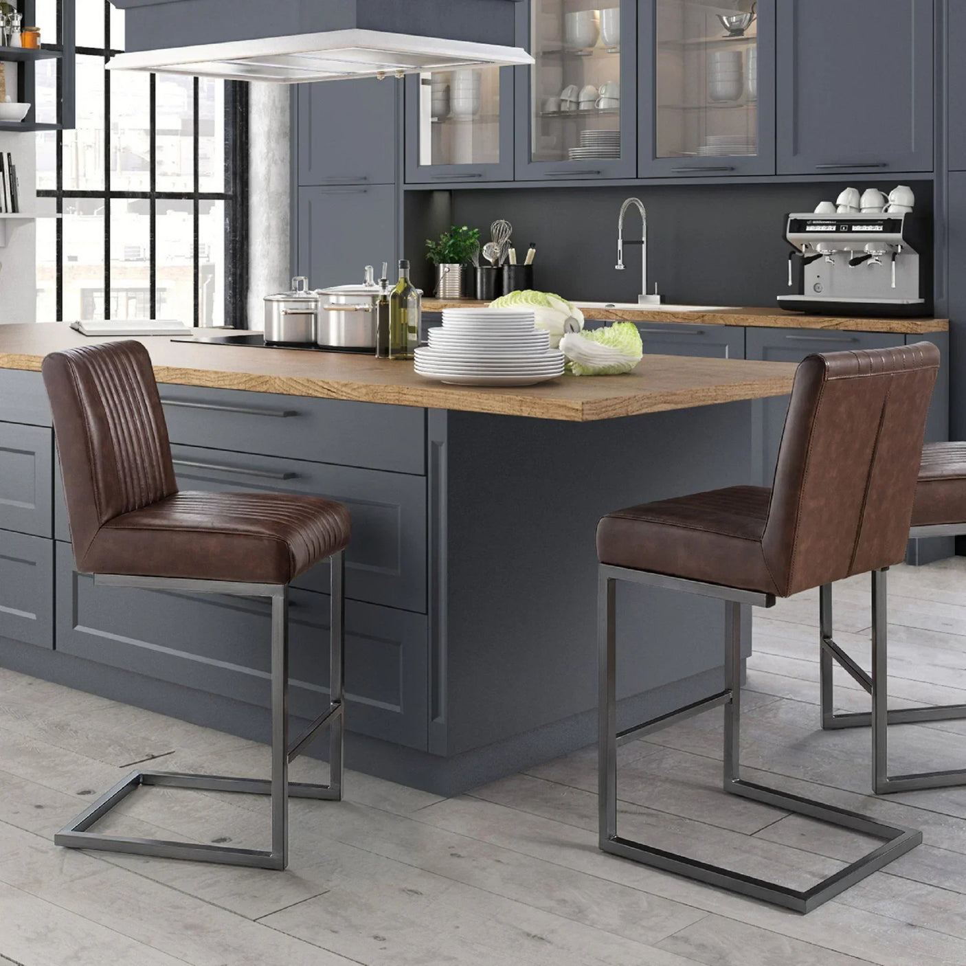 Brown leather bar stools with metal legs at a kitchen island in modern dining room