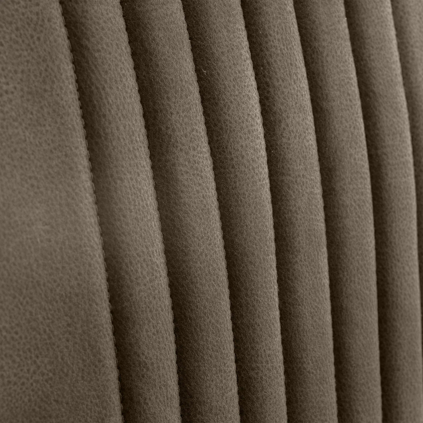 Charcoal grey dining chair fabric detail with vertical channel stitching