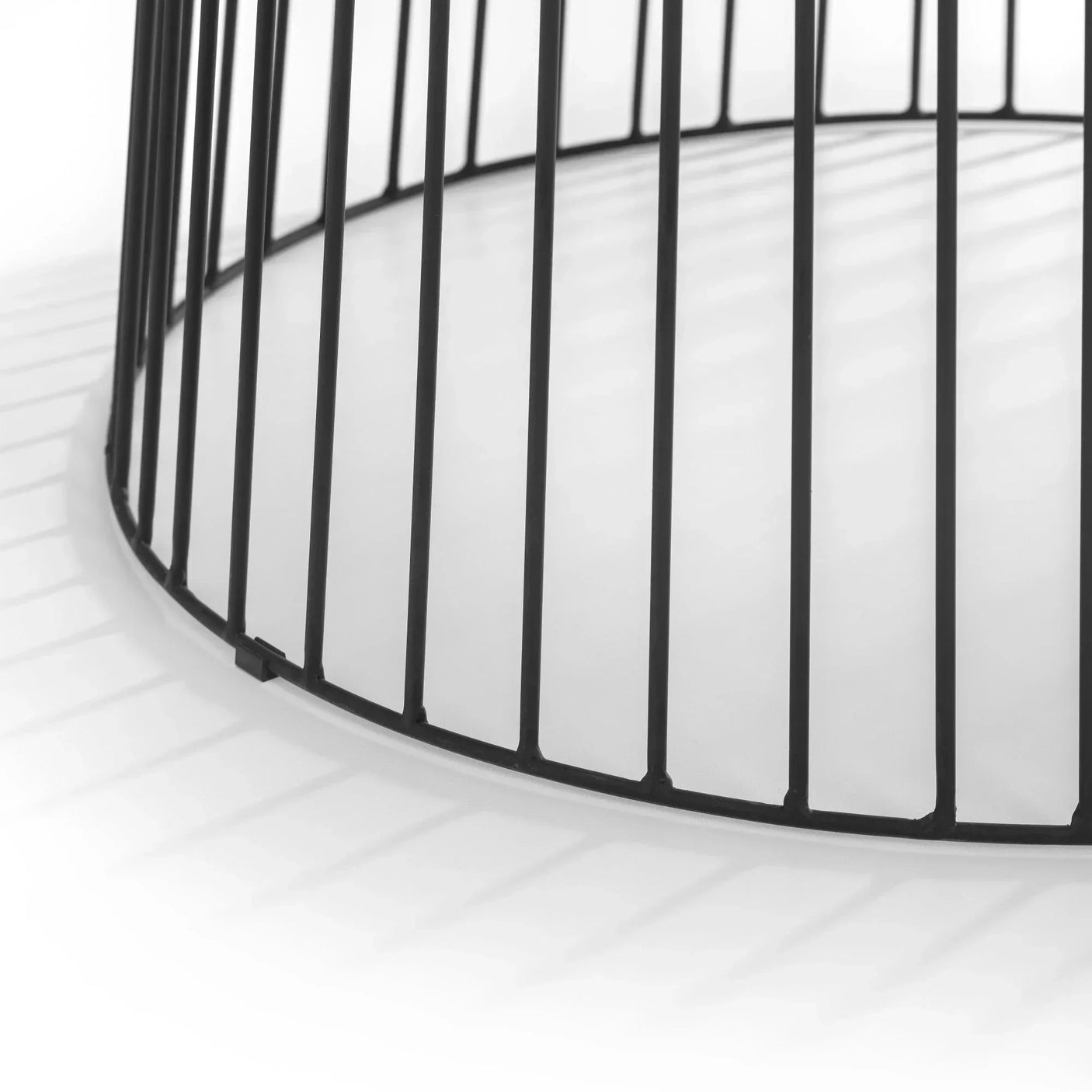 Black metal side table base with vertical bars and round design