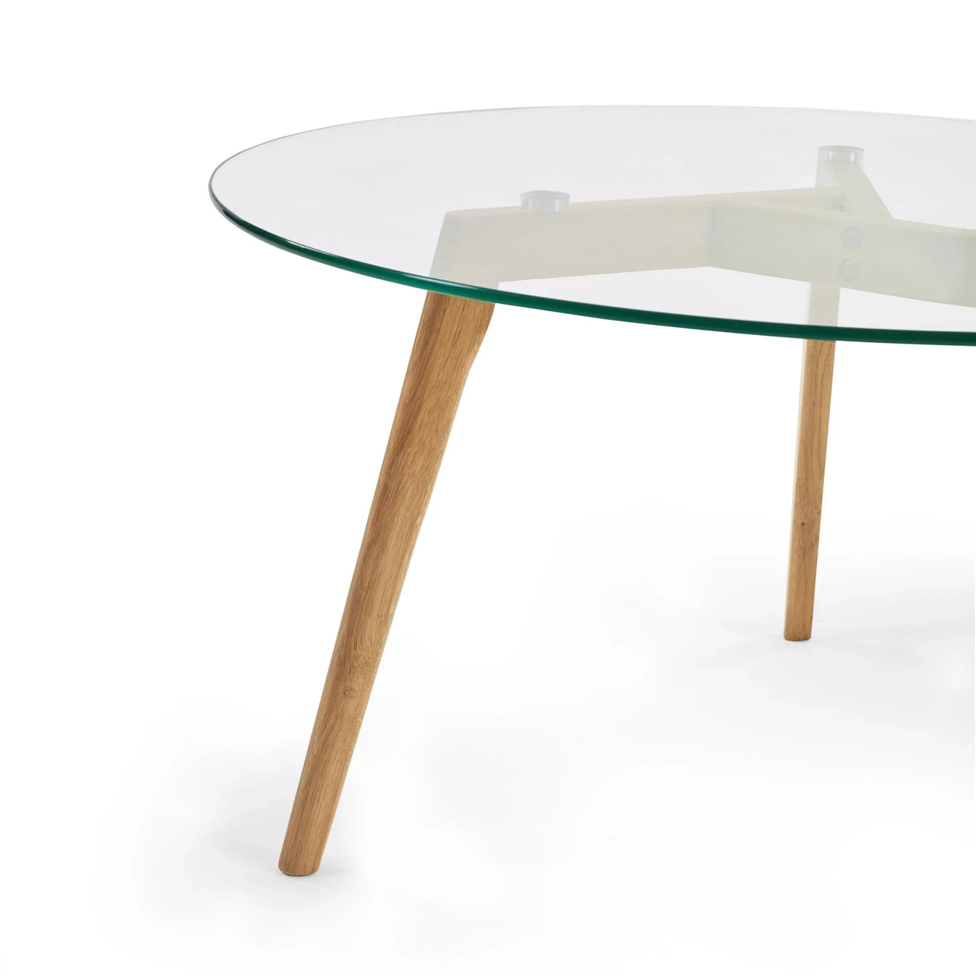 Round glass dining table with wooden legs, close view of tabletop and frame