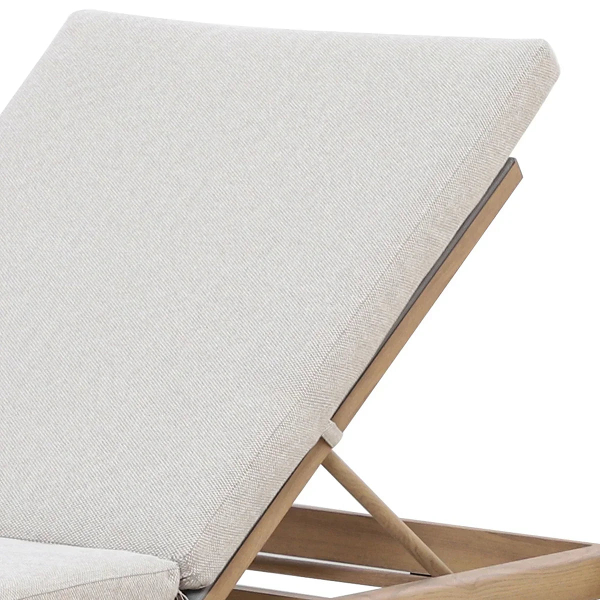 Closeup of beige sun lounger cushion on wooden frame, side angle view