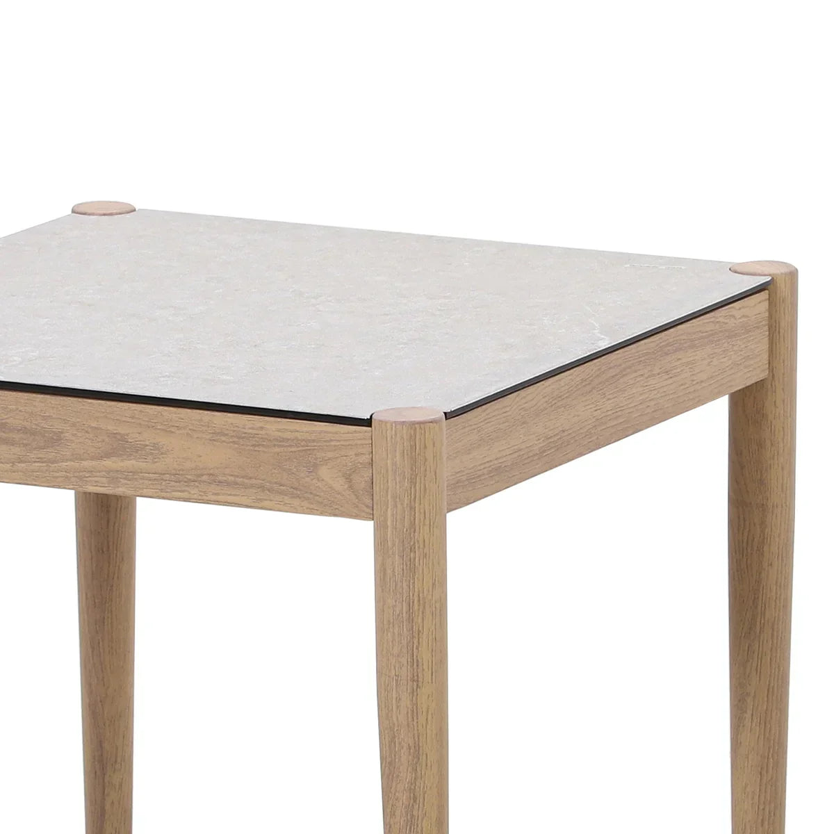 Square side table with light wood frame and pale stone effect top, close corner view