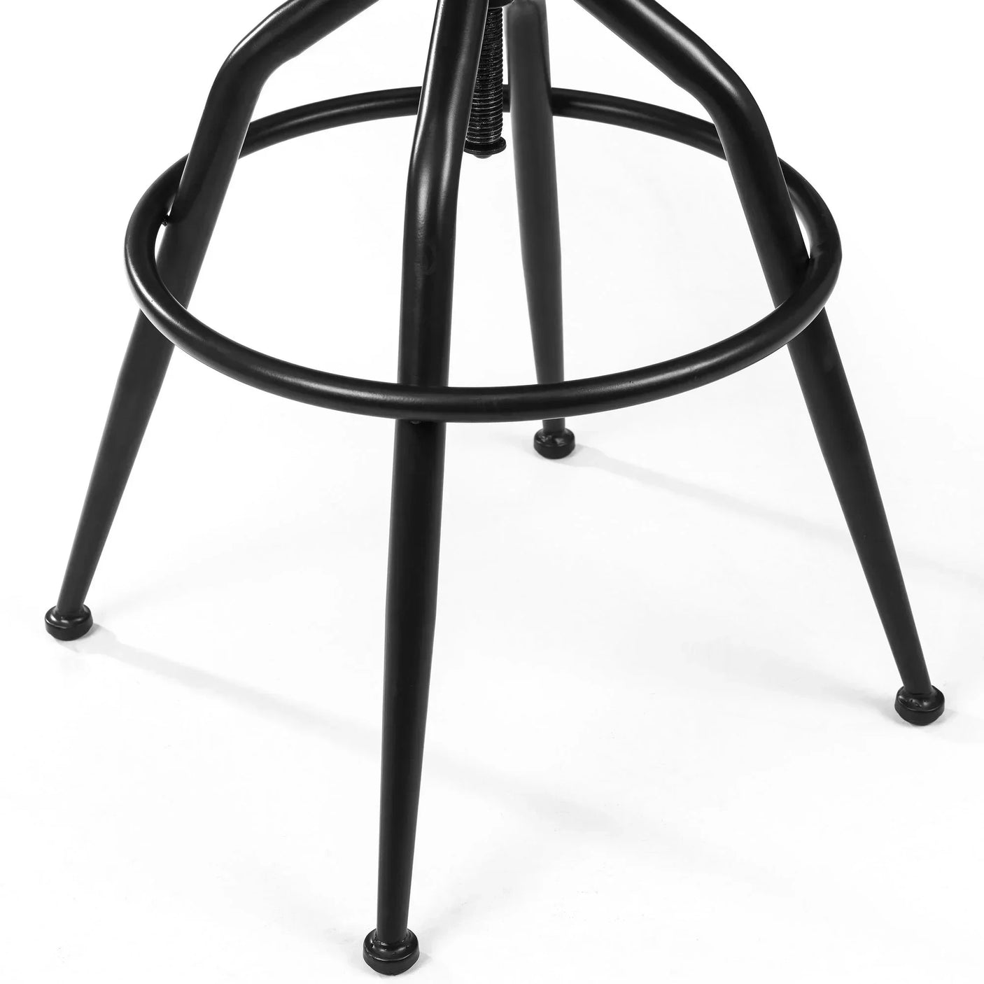 Black metal bar stool legs with circular footrest on white background