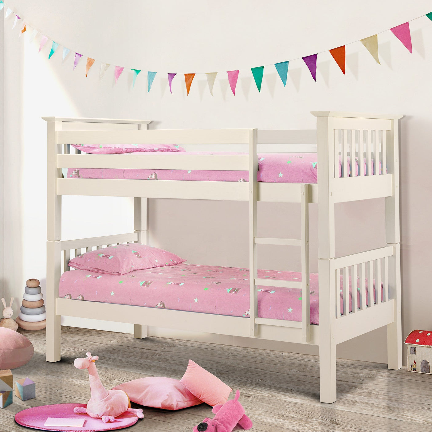Stone white wooden bunk bed with ladder in kids room, pink bedding, toys on wooden floor
